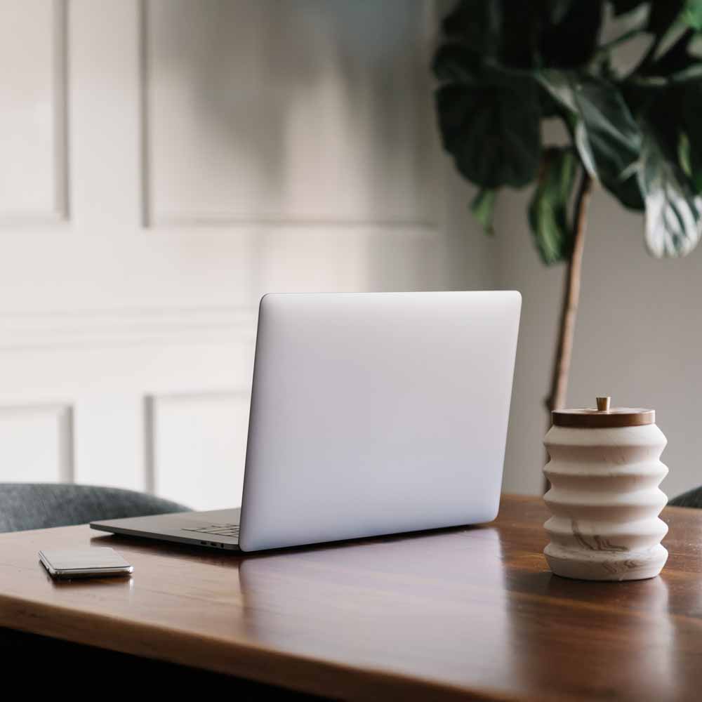 Laptop and phone on a desk