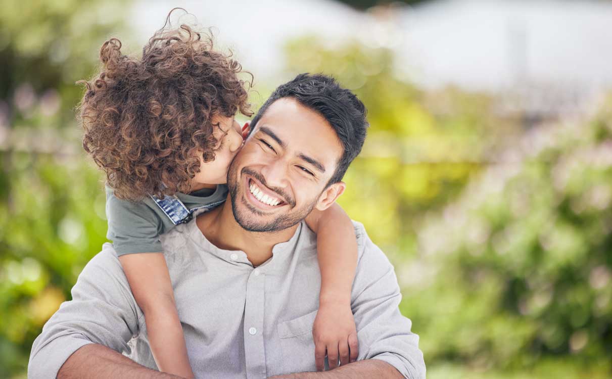 Dad and son together and smiling